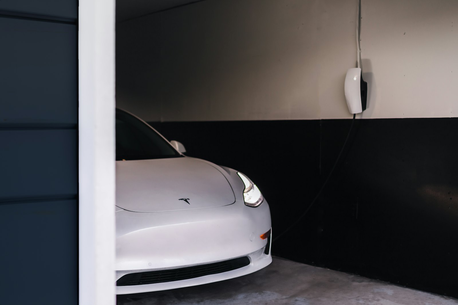 Tesla Wall Connector mounted in a residential garage
